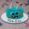 Pastel monstruo azul para Día del Niño decorado con textura tipo peluche, ojos grandes y cuernos, ideal para fiesta infantil